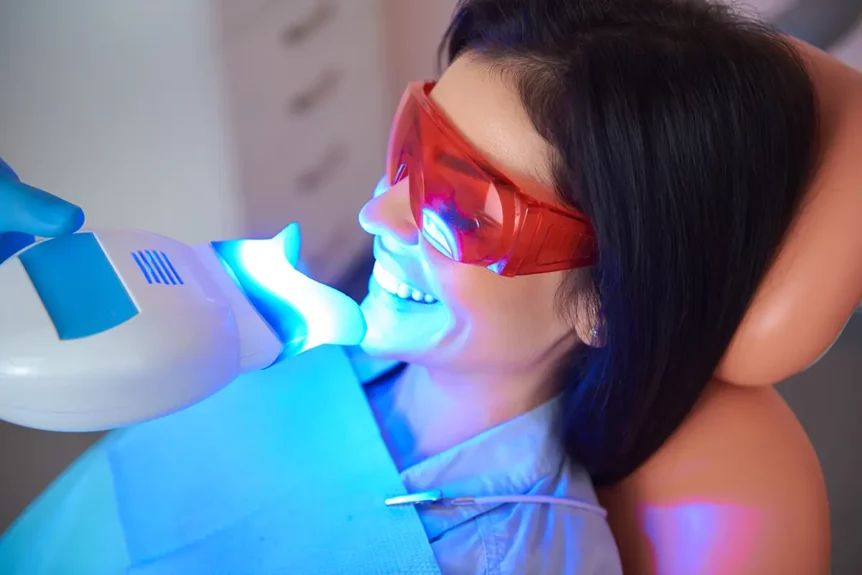 A female patient at Chomp Dental receiving teeth whitening treatment